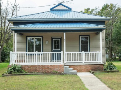 This beautifully redone 3-bedroom, 1-bathroom home offers modern on Nashua Town and Country Club in Iowa - for sale on GolfHomes.com, golf home, golf lot