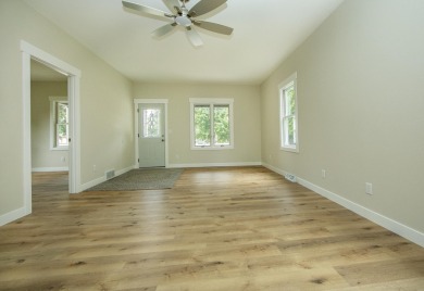 This beautifully redone 3-bedroom, 1-bathroom home offers modern on Nashua Town and Country Club in Iowa - for sale on GolfHomes.com, golf home, golf lot