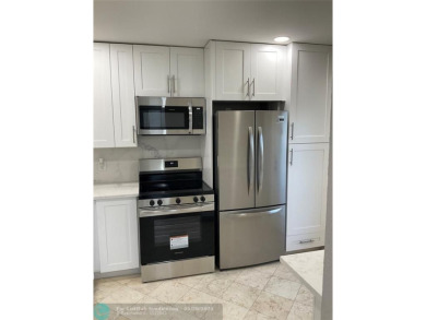 This beautifully remodeled condo in a gated community provides on Inverrary Country Club in Florida - for sale on GolfHomes.com, golf home, golf lot