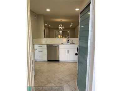 This beautifully remodeled condo in a gated community provides on Inverrary Country Club in Florida - for sale on GolfHomes.com, golf home, golf lot