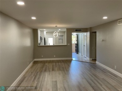 This beautifully remodeled condo in a gated community provides on Inverrary Country Club in Florida - for sale on GolfHomes.com, golf home, golf lot