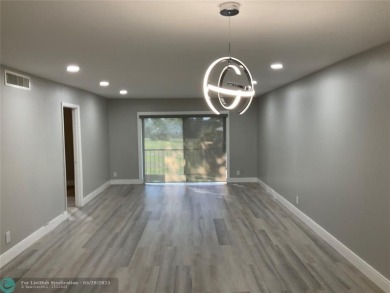 This beautifully remodeled condo in a gated community provides on Inverrary Country Club in Florida - for sale on GolfHomes.com, golf home, golf lot