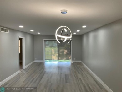 This beautifully remodeled condo in a gated community provides on Inverrary Country Club in Florida - for sale on GolfHomes.com, golf home, golf lot