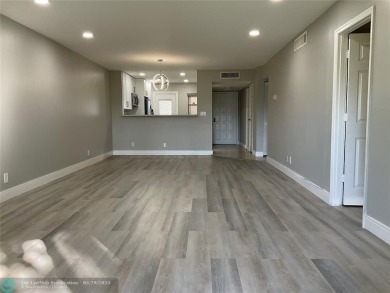 This beautifully remodeled condo in a gated community provides on Inverrary Country Club in Florida - for sale on GolfHomes.com, golf home, golf lot