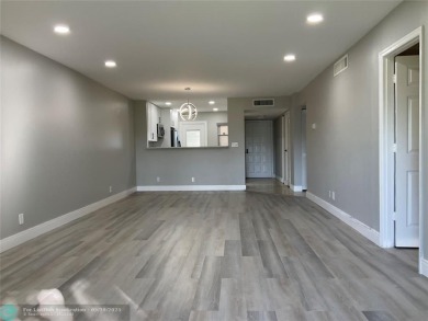 This beautifully remodeled condo in a gated community provides on Inverrary Country Club in Florida - for sale on GolfHomes.com, golf home, golf lot