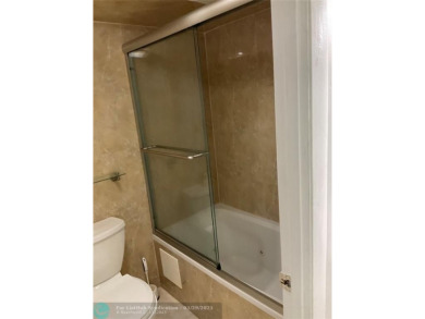 This beautifully remodeled condo in a gated community provides on Inverrary Country Club in Florida - for sale on GolfHomes.com, golf home, golf lot