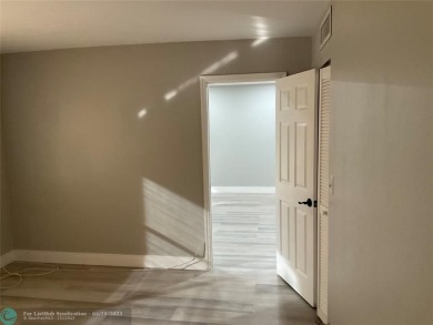 This beautifully remodeled condo in a gated community provides on Inverrary Country Club in Florida - for sale on GolfHomes.com, golf home, golf lot