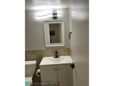This beautifully remodeled condo in a gated community provides on Inverrary Country Club in Florida - for sale on GolfHomes.com, golf home, golf lot