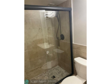 This beautifully remodeled condo in a gated community provides on Inverrary Country Club in Florida - for sale on GolfHomes.com, golf home, golf lot