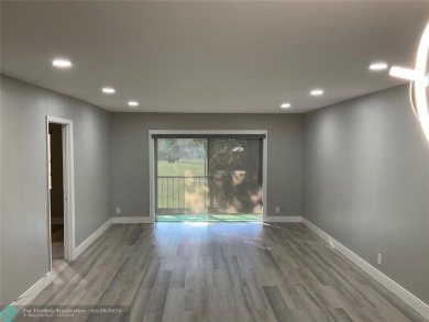 This beautifully remodeled condo in a gated community provides on Inverrary Country Club in Florida - for sale on GolfHomes.com, golf home, golf lot