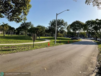 This beautifully remodeled condo in a gated community provides on Inverrary Country Club in Florida - for sale on GolfHomes.com, golf home, golf lot
