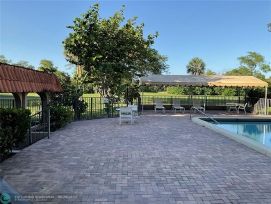 This beautifully remodeled condo in a gated community provides on Inverrary Country Club in Florida - for sale on GolfHomes.com, golf home, golf lot