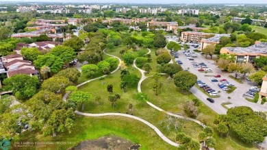 This beautifully remodeled condo in a gated community provides on Inverrary Country Club in Florida - for sale on GolfHomes.com, golf home, golf lot