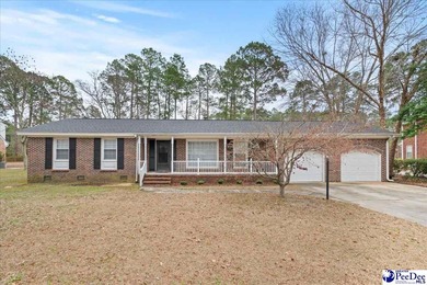 This well-maintained brick ranch home is perfectly situated on on Hartsville Country Club in South Carolina - for sale on GolfHomes.com, golf home, golf lot