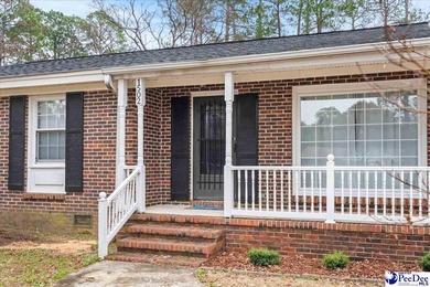 This well-maintained brick ranch home is perfectly situated on on Hartsville Country Club in South Carolina - for sale on GolfHomes.com, golf home, golf lot