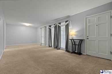 This well-maintained brick ranch home is perfectly situated on on Hartsville Country Club in South Carolina - for sale on GolfHomes.com, golf home, golf lot