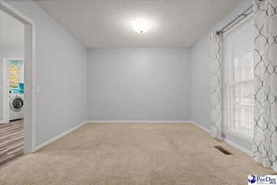 This well-maintained brick ranch home is perfectly situated on on Hartsville Country Club in South Carolina - for sale on GolfHomes.com, golf home, golf lot