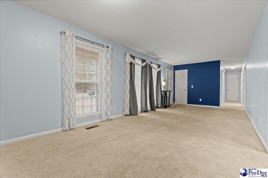 This well-maintained brick ranch home is perfectly situated on on Hartsville Country Club in South Carolina - for sale on GolfHomes.com, golf home, golf lot