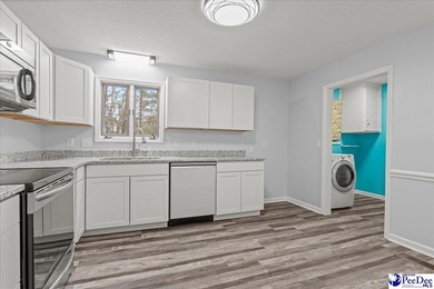 This well-maintained brick ranch home is perfectly situated on on Hartsville Country Club in South Carolina - for sale on GolfHomes.com, golf home, golf lot