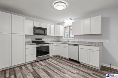 This well-maintained brick ranch home is perfectly situated on on Hartsville Country Club in South Carolina - for sale on GolfHomes.com, golf home, golf lot