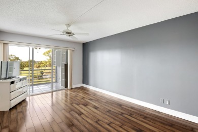 WELCOME TO THIS NATURALLY BRIGHT CONDO WITH EXPANDED SQUARE on Poinciana Golf Club in Florida - for sale on GolfHomes.com, golf home, golf lot