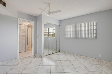 WELCOME TO THIS NATURALLY BRIGHT CONDO WITH EXPANDED SQUARE on Poinciana Golf Club in Florida - for sale on GolfHomes.com, golf home, golf lot