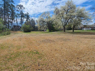 Come discover a large, beautiful mostly cleared .99 acre lot in on Rock Hill Country Club in South Carolina - for sale on GolfHomes.com, golf home, golf lot