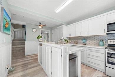 This beautifully updated coastal townhouse blends everyday on Miles Grant Country Club in Florida - for sale on GolfHomes.com, golf home, golf lot