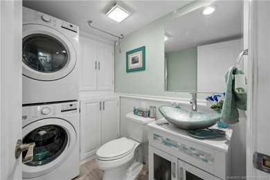 This beautifully updated coastal townhouse blends everyday on Miles Grant Country Club in Florida - for sale on GolfHomes.com, golf home, golf lot