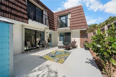 This beautifully updated coastal townhouse blends everyday on Miles Grant Country Club in Florida - for sale on GolfHomes.com, golf home, golf lot