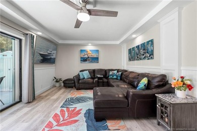 This beautifully updated coastal townhouse blends everyday on Miles Grant Country Club in Florida - for sale on GolfHomes.com, golf home, golf lot