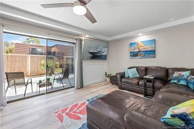 This beautifully updated coastal townhouse blends everyday on Miles Grant Country Club in Florida - for sale on GolfHomes.com, golf home, golf lot