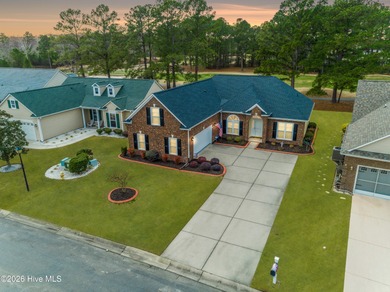 Golf-front living, sunset views, and coastal convenience-this on Meadowlands Golf Club in North Carolina - for sale on GolfHomes.com, golf home, golf lot