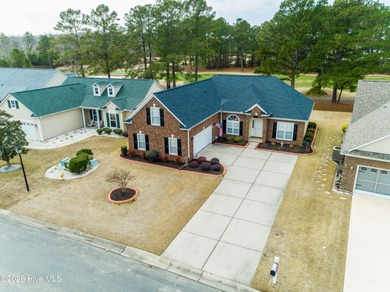 Golf-front living, sunset views, and coastal convenience-this on Meadowlands Golf Club in North Carolina - for sale on GolfHomes.com, golf home, golf lot