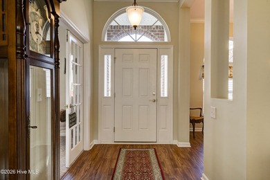 Golf-front living, sunset views, and coastal convenience-this on Meadowlands Golf Club in North Carolina - for sale on GolfHomes.com, golf home, golf lot