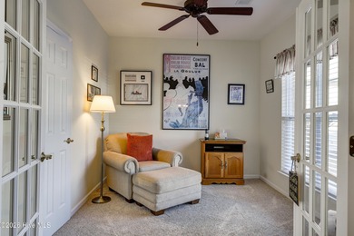 Golf-front living, sunset views, and coastal convenience-this on Meadowlands Golf Club in North Carolina - for sale on GolfHomes.com, golf home, golf lot