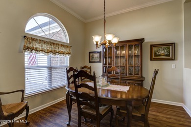 Golf-front living, sunset views, and coastal convenience-this on Meadowlands Golf Club in North Carolina - for sale on GolfHomes.com, golf home, golf lot