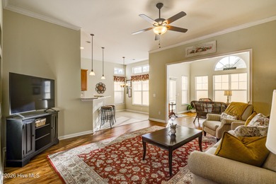 Golf-front living, sunset views, and coastal convenience-this on Meadowlands Golf Club in North Carolina - for sale on GolfHomes.com, golf home, golf lot