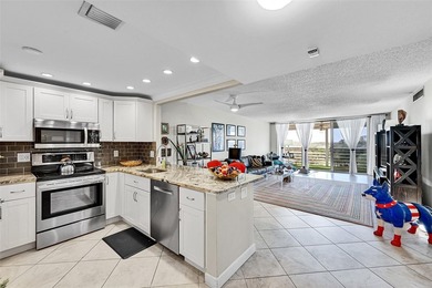 This fully remodeled unit features an open kitchen with white on Palm-Aire Country Club and Resort - Palms in Florida - for sale on GolfHomes.com, golf home, golf lot
