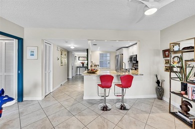 This fully remodeled unit features an open kitchen with white on Palm-Aire Country Club and Resort - Palms in Florida - for sale on GolfHomes.com, golf home, golf lot