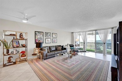 This fully remodeled unit features an open kitchen with white on Palm-Aire Country Club and Resort - Palms in Florida - for sale on GolfHomes.com, golf home, golf lot