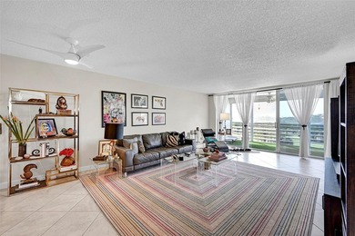 This fully remodeled unit features an open kitchen with white on Palm-Aire Country Club and Resort - Palms in Florida - for sale on GolfHomes.com, golf home, golf lot
