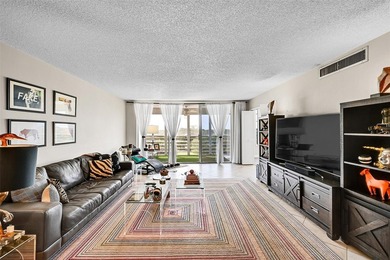 This fully remodeled unit features an open kitchen with white on Palm-Aire Country Club and Resort - Palms in Florida - for sale on GolfHomes.com, golf home, golf lot