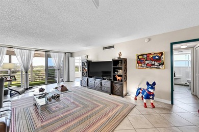 This fully remodeled unit features an open kitchen with white on Palm-Aire Country Club and Resort - Palms in Florida - for sale on GolfHomes.com, golf home, golf lot