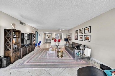 This fully remodeled unit features an open kitchen with white on Palm-Aire Country Club and Resort - Palms in Florida - for sale on GolfHomes.com, golf home, golf lot