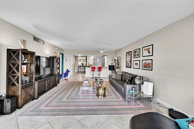 This fully remodeled unit features an open kitchen with white on Palm-Aire Country Club and Resort - Palms in Florida - for sale on GolfHomes.com, golf home, golf lot