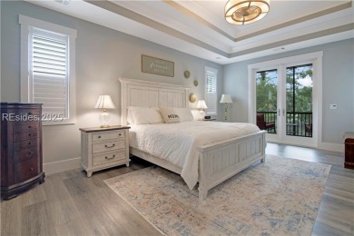 Enjoying views across a lake toward Moss Creek South's 8 th Hole on Moss Creek Golf Club in South Carolina - for sale on GolfHomes.com, golf home, golf lot