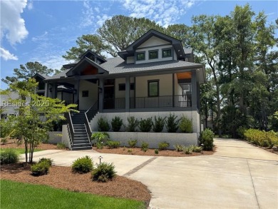 Enjoying views across a lake toward Moss Creek South's 8 th Hole on Moss Creek Golf Club in South Carolina - for sale on GolfHomes.com, golf home, golf lot