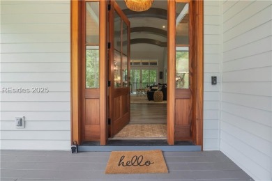 Enjoying views across a lake toward Moss Creek South's 8 th Hole on Moss Creek Golf Club in South Carolina - for sale on GolfHomes.com, golf home, golf lot