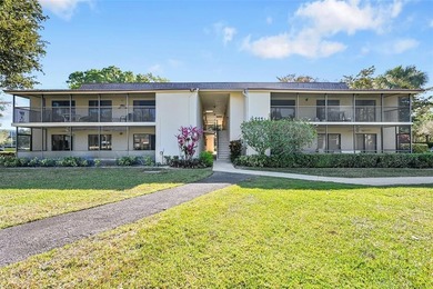 This second-floor unit in Hidden Woods of Deer Creek is a prime on Deer Creek Golf Club in Florida - for sale on GolfHomes.com, golf home, golf lot